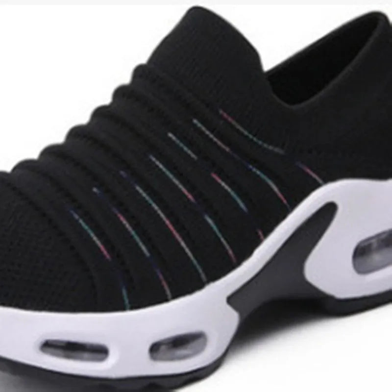 Women's plus size fly-knit sock shoes in stretch mesh material with low heel and round toe