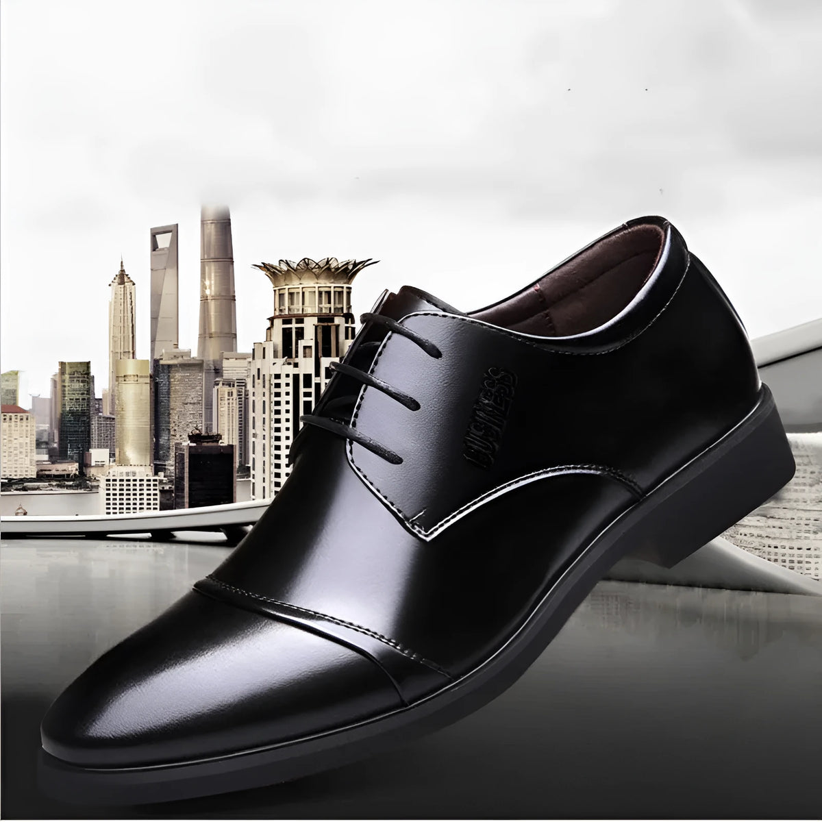 Men's black leather lace-up shoe with decorative stitching and a horse buckle on a rubber sole.