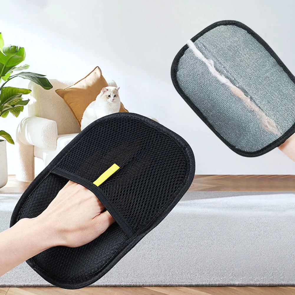 Black pet hair remover glove with soft silicone bristles on a hand, showing the dual-sided design.