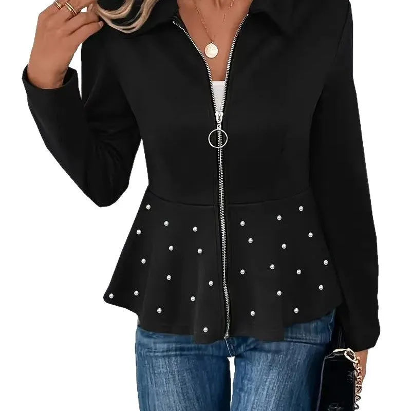 Women's loose-fit black coat with heavy-duty beaded zipper and ruffled hem, long sleeves.