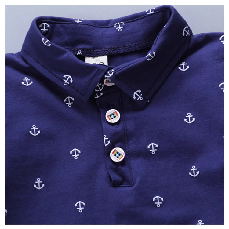 Anchor print children's cotton pullover pants suit in blue, shown flat.