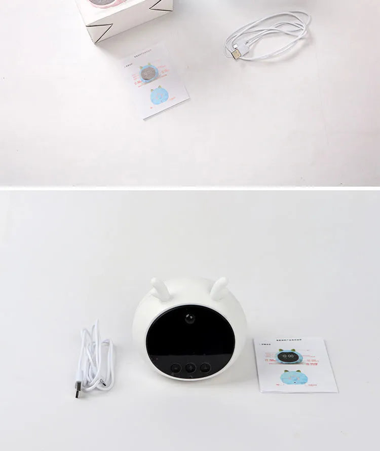 White Deer style smart alarm clock with digital display, silicone shell, and power cord.