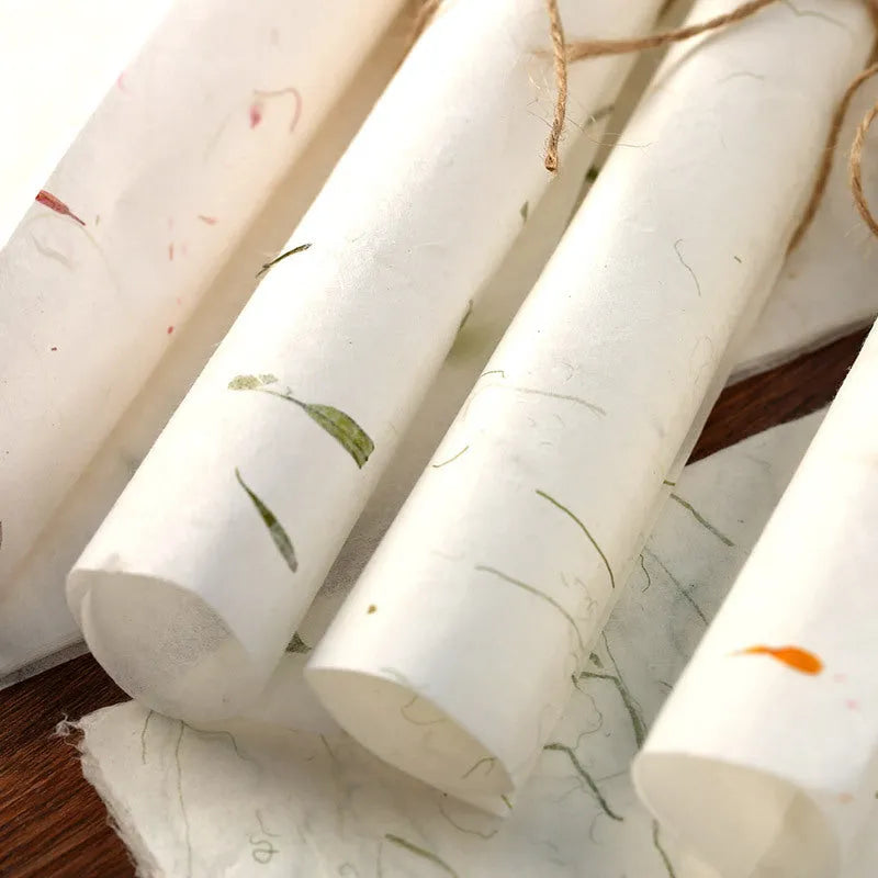 Ten sheets of Chinese ancient-style painting paper in green, red, and yellow designs, measuring 27.5 by 16.7 cm