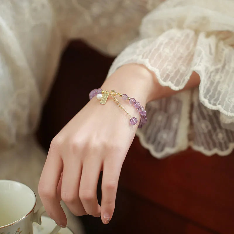 Natural lavender amethyst crystal bracelet with zodiac motifs and adjustable clasp in light or dark colour options