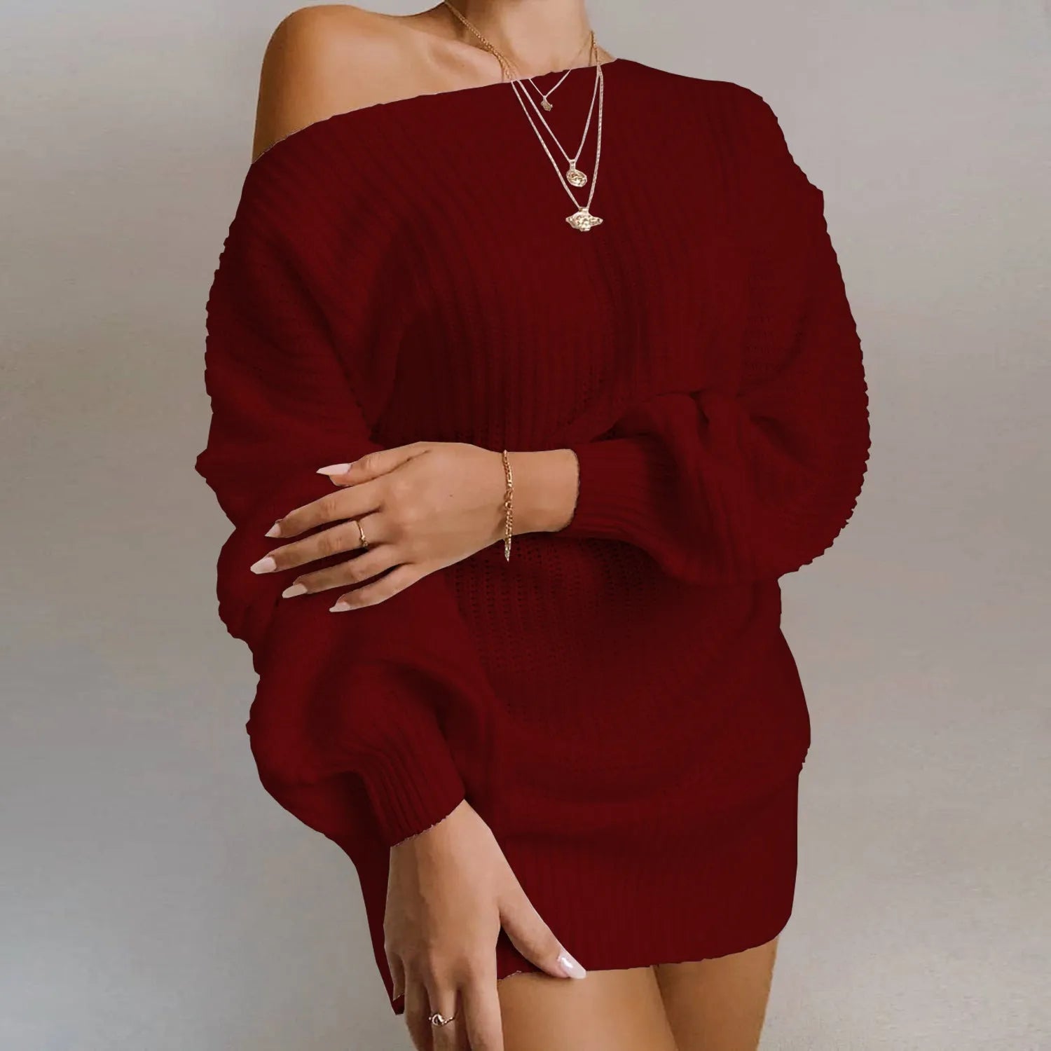 Women's solid colour off-the-shoulder knitted dress with lantern sleeves in a mid-length style.