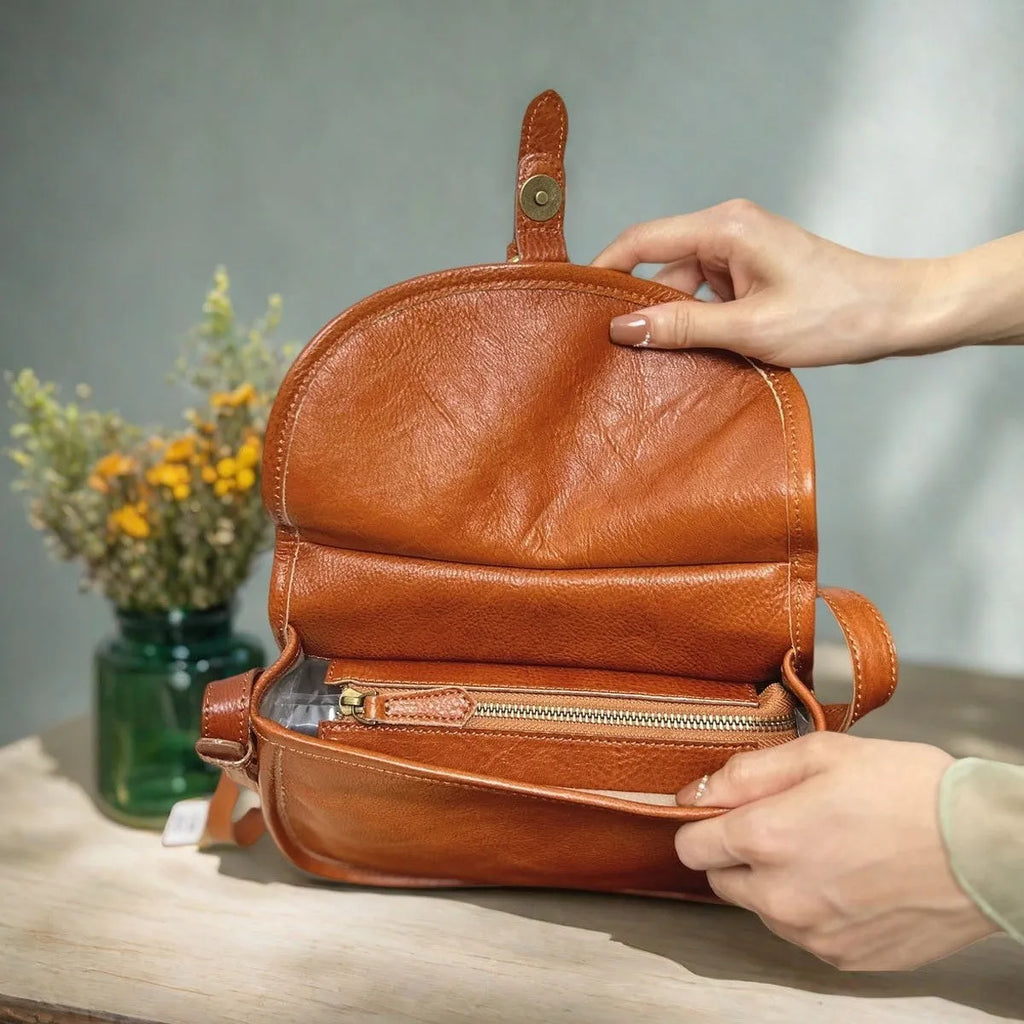 Brown retro-style genuine leather messenger bag with flap closure and crossbody strap