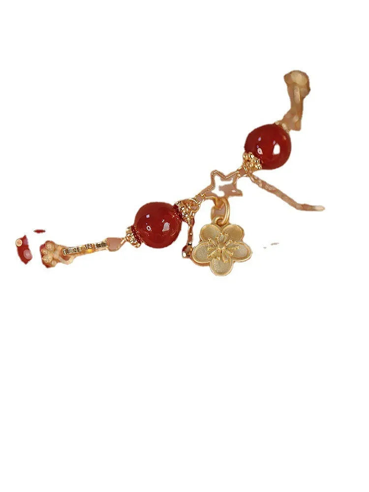 Women's red agate double layer bracelet with floral motifs and adjustable sliding knot closure
