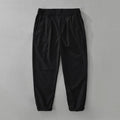 Men's loose straight-leg trousers in a cotton linen blend, shown in a solid colour.