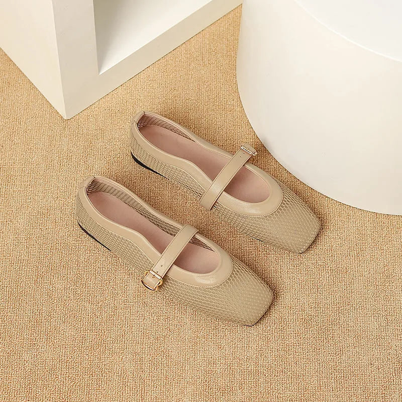 Women's beige mesh summer hiking pumps with a buckle and flat heel on a plain background.