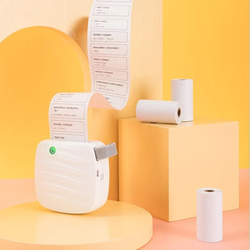 Three rolls of white 57mm thermal paper for portable printers on a blue background.