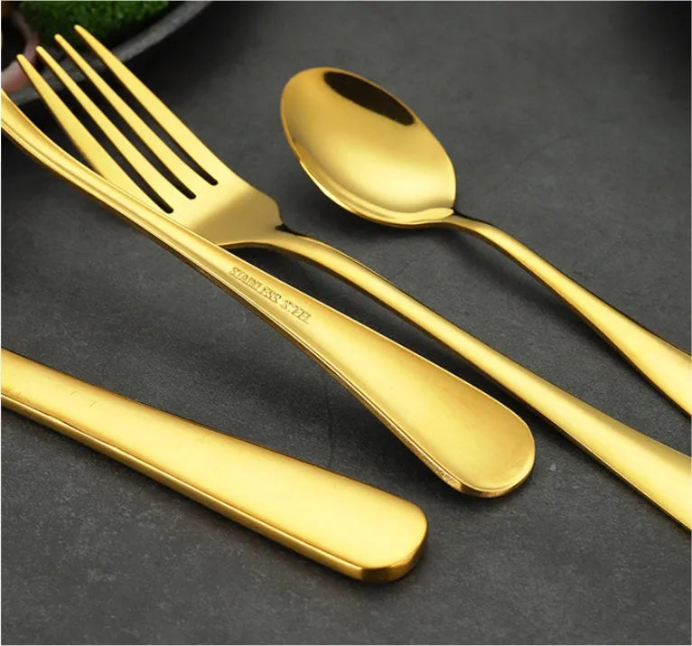 24-piece stainless steel cutlery set showing knives, forks, tablespoons and teaspoons in multiple finish colours
