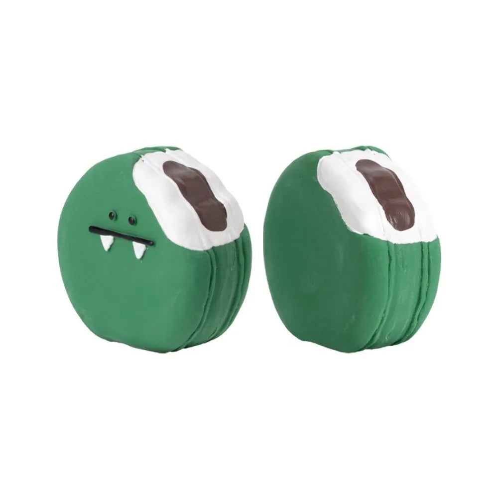 Yellow and green latex dog chew toy shaped like an egg bread with a cartoon puppy pattern.