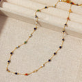 Women's gold titanium steel necklace with a simple natural stone pendant on an O-ring chain.