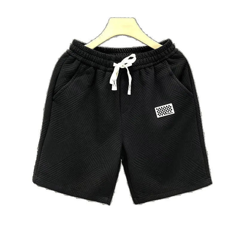 Casual sports shorts in solid colour with elastic waistband, suitable for active wear