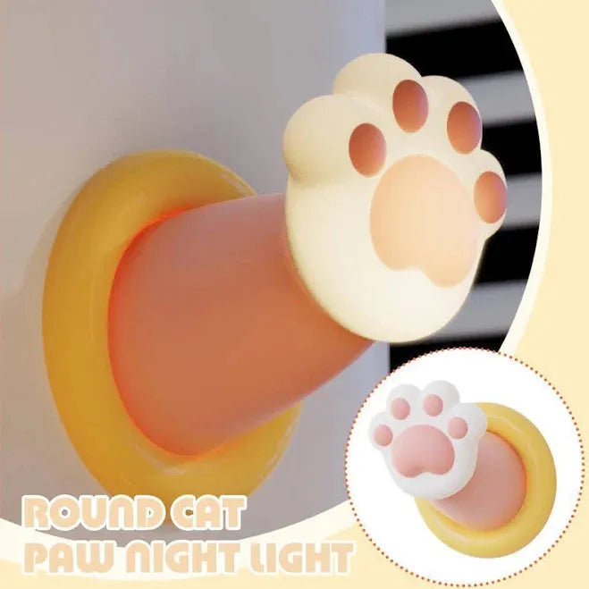 White cat paw shaped touch control night light lamp on a wooden nightstand.