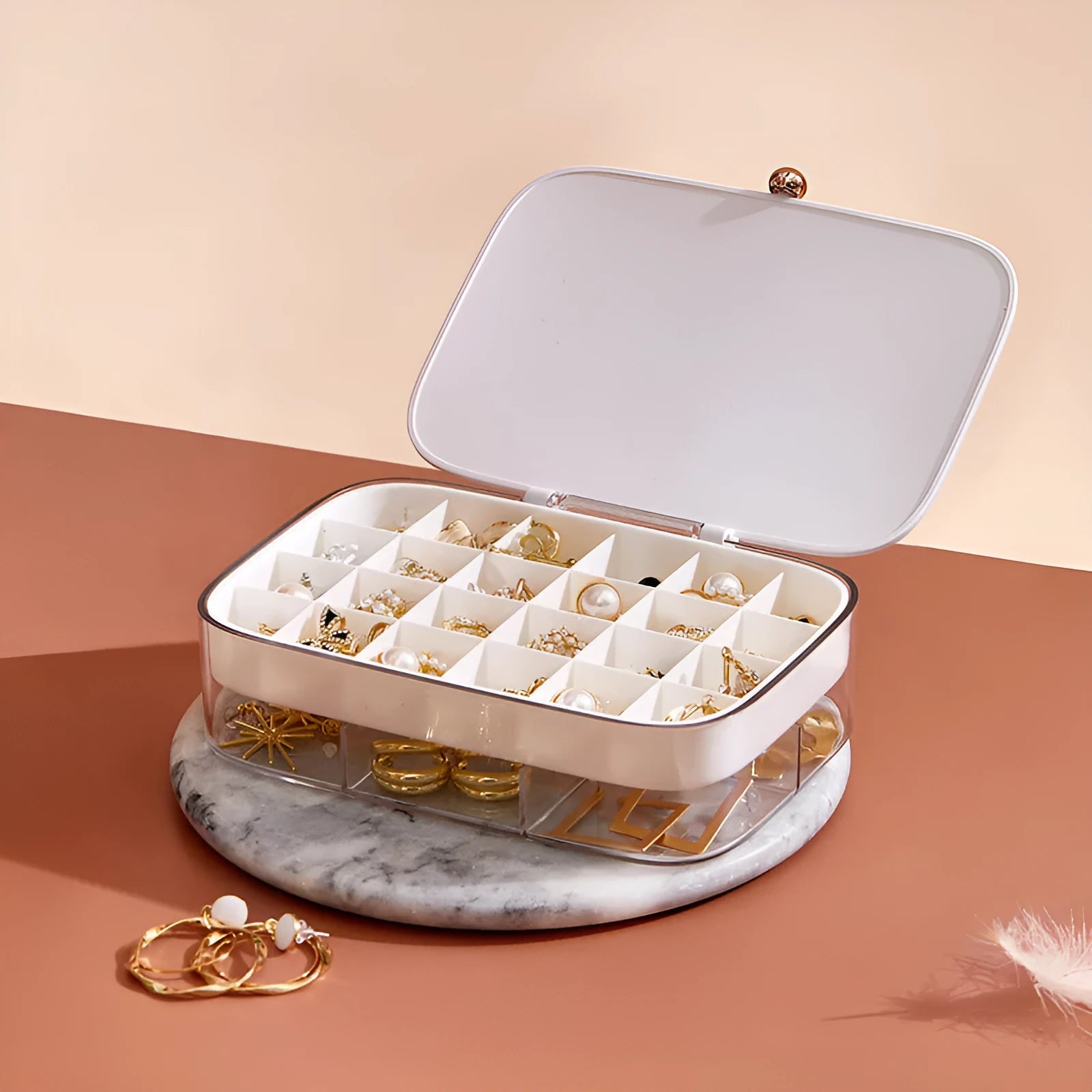 Green minimalist multi-layer jewellery storage box with lid open, showing internal compartments.