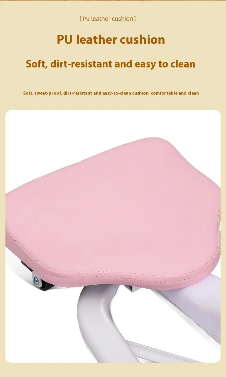 A pink leg stretching device with a steel frame and foam padding, shown on a gym floor.