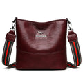 PU bucket bag 23.5x22x12cm with polyester lining and sandwich pocket in black, red, or yellow