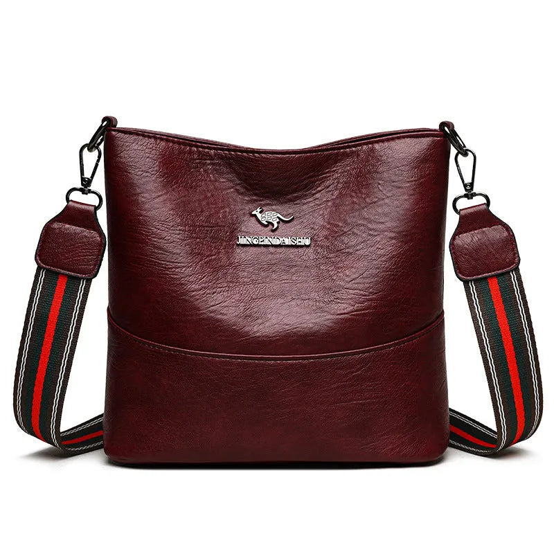 PU bucket bag 23.5x22x12cm with polyester lining and sandwich pocket in black, red, or yellow