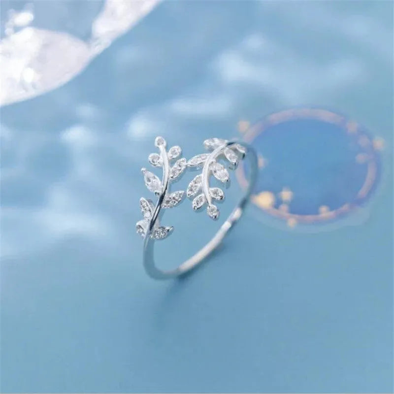 Copper leaf branch fashion ring for women with electroplated gold or silver finish.