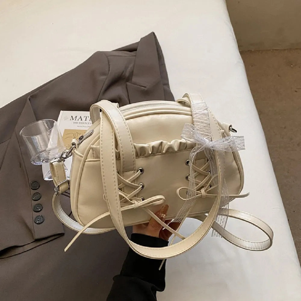 Women's bandage bow handbag in PU leather with mobile phone compartment and decorative sewing thread details