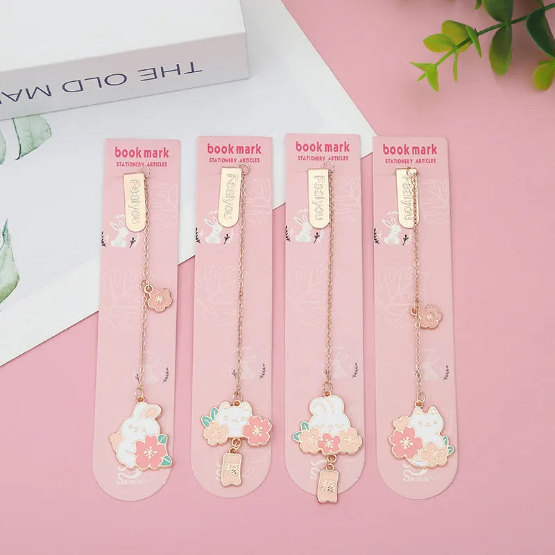 Creative cartoon metal pendant book holder with cherry blossom cat design for journal decoration.