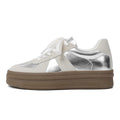 Retro round toe board shoes with cross shoulder straps in milky white, showing front lace-up detail.