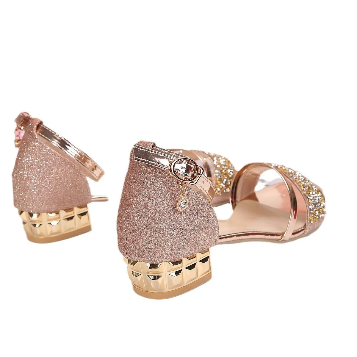 Women's black Roman-style sandals with rhinestone buckle strap on a rubber sole.