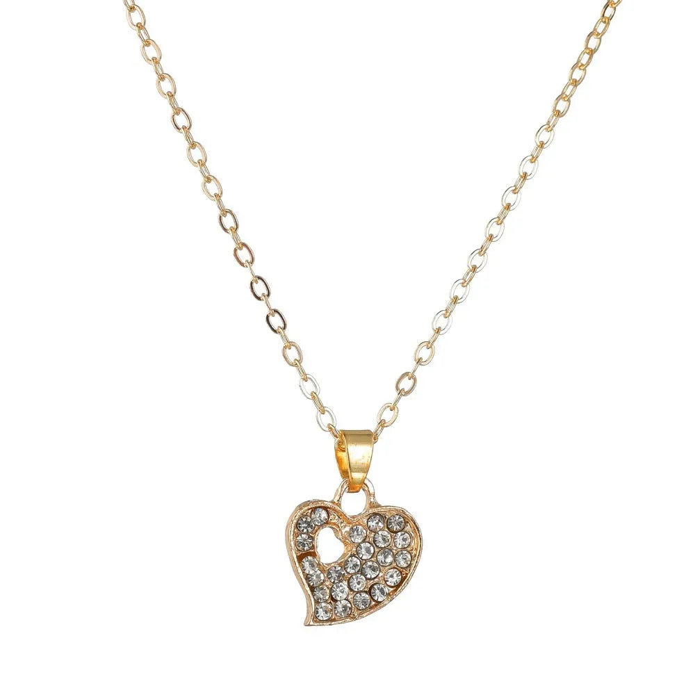 Gold electroplated alloy women's jewellery set with love, water drop, and bell patterned earrings, pendant, and bracelet.