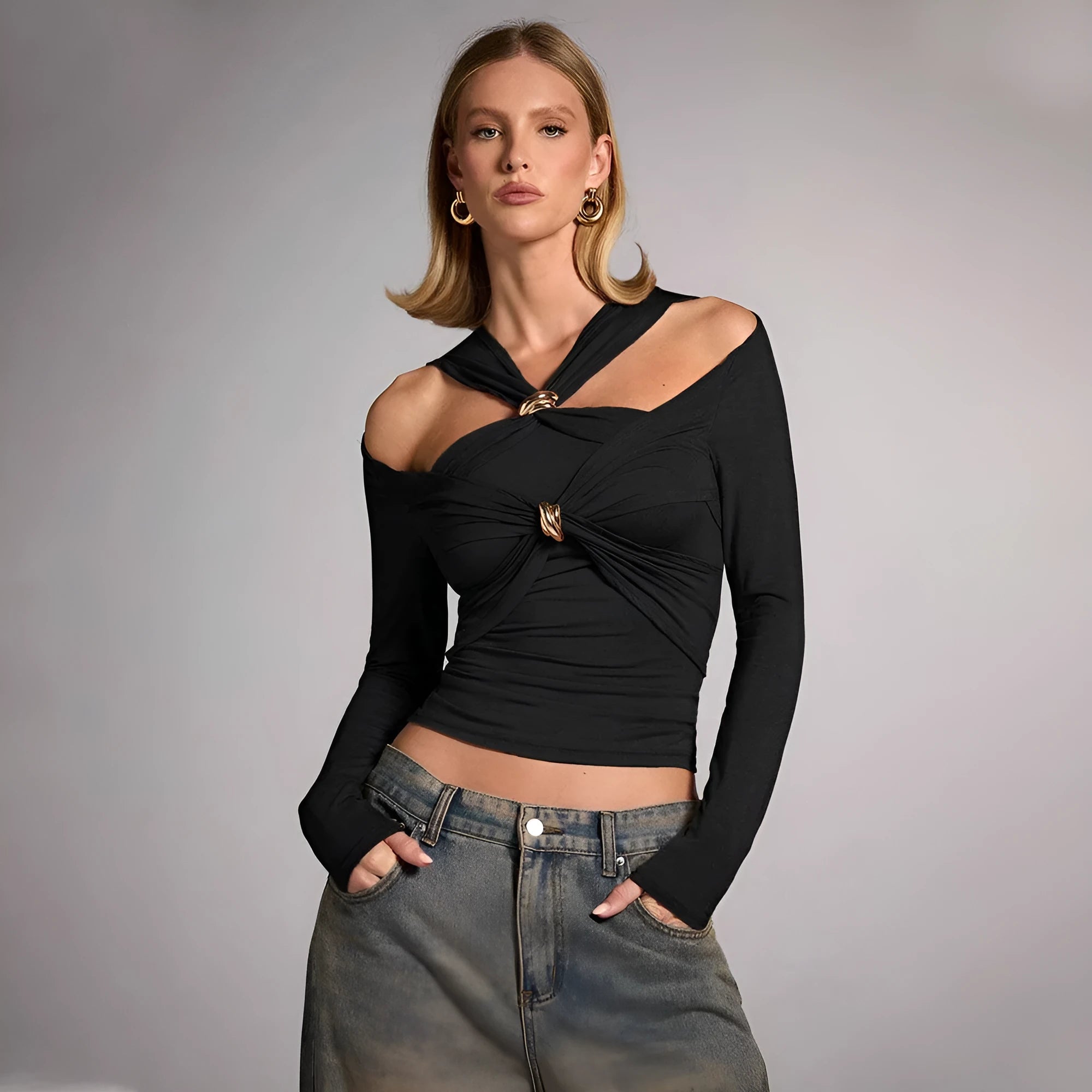 Black women's halterneck slim-fit top with long sleeves on a model.