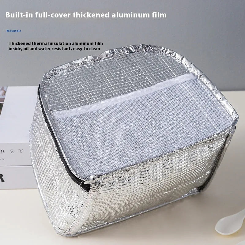 Insulated lunch box bag in sapphire blue with textured cloth exterior and secure closure