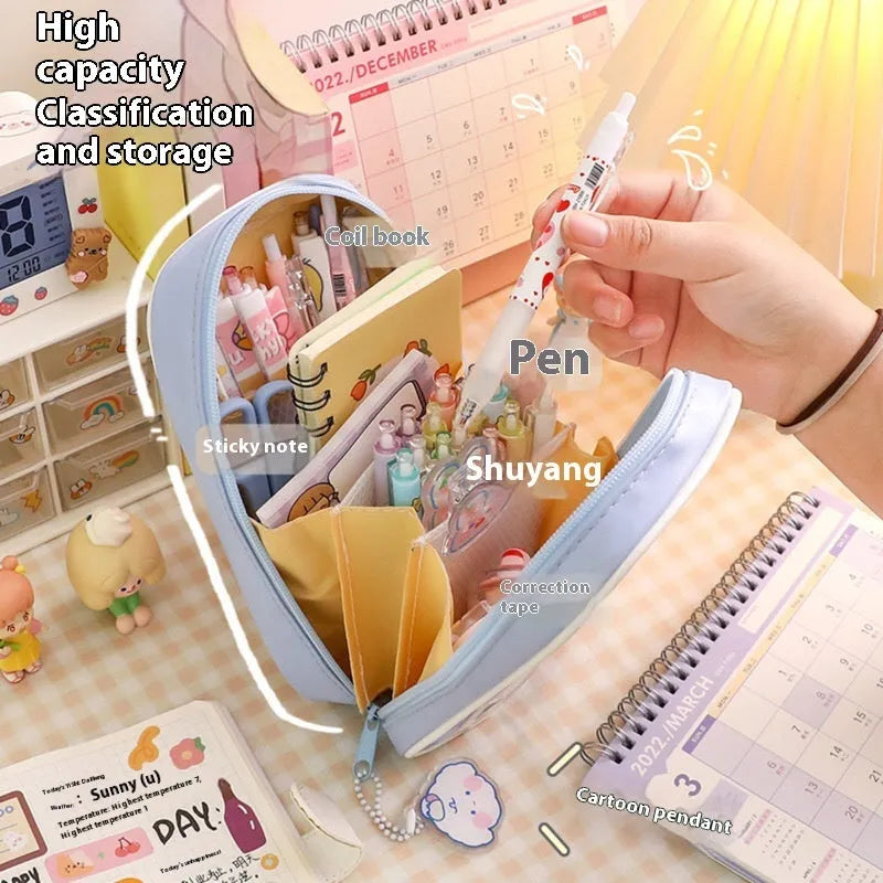 Transparent PVC pencil case with cartoon design showing pens and pencils inside