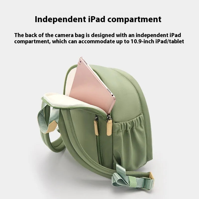 Green polyester shoulder camera bag for women with a curved strap and front patchwork panel.