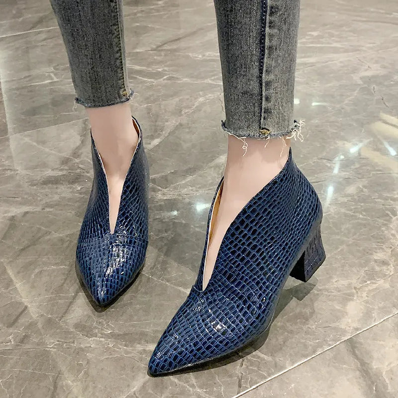 Women's V-cut ankle boots with pointed toe and embossed PU upper in black colour with chunky heel