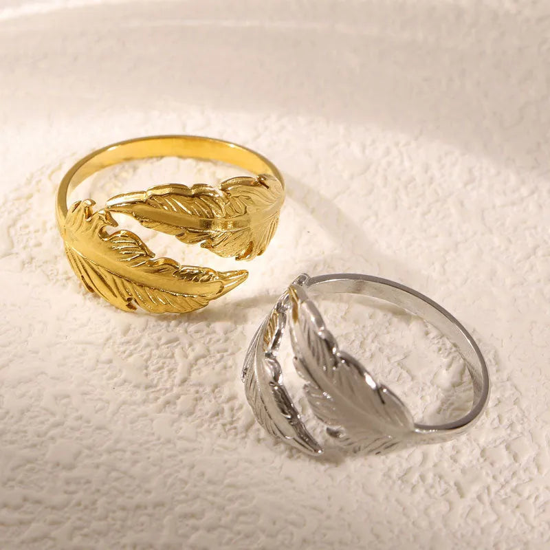 Women's adjustable opening feather fashion ring in silver or gold colour on titanium steel.