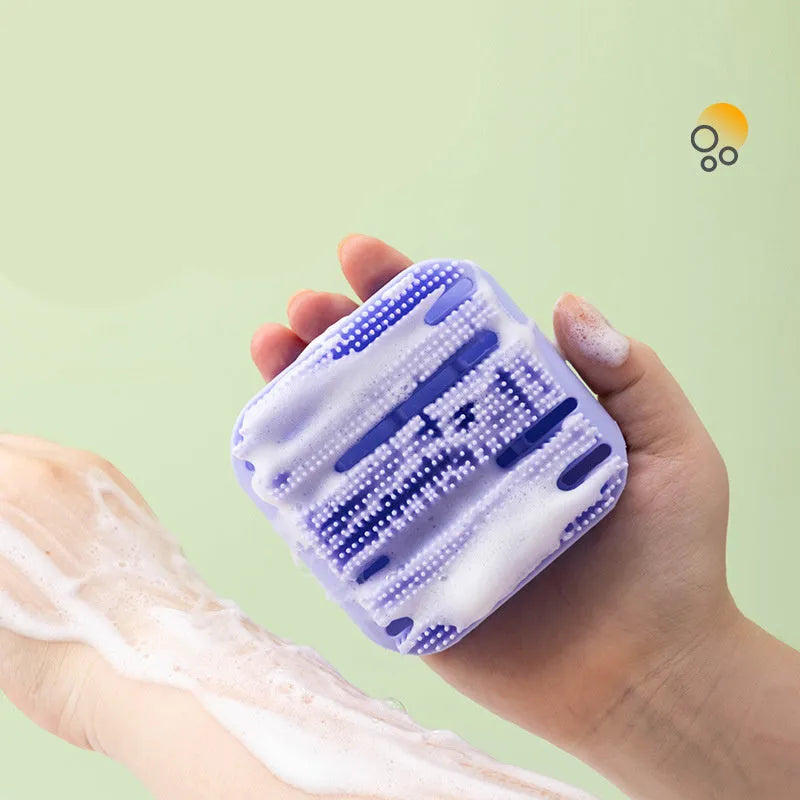 Blue silicone scalp massager brush with long bristles and a hand-through ergonomic handle.