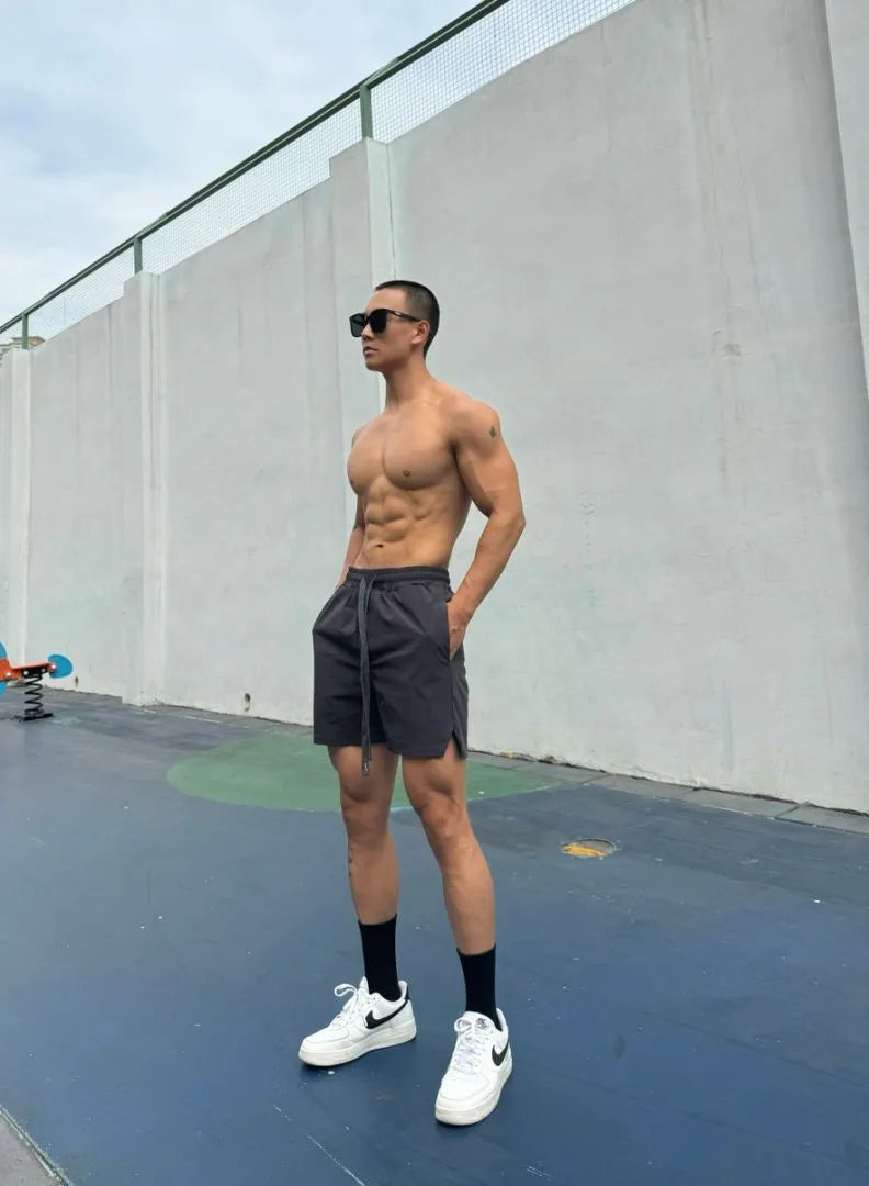 Men's ice silk quick-drying double-layer shorts in multiple colours showing quarter-length design