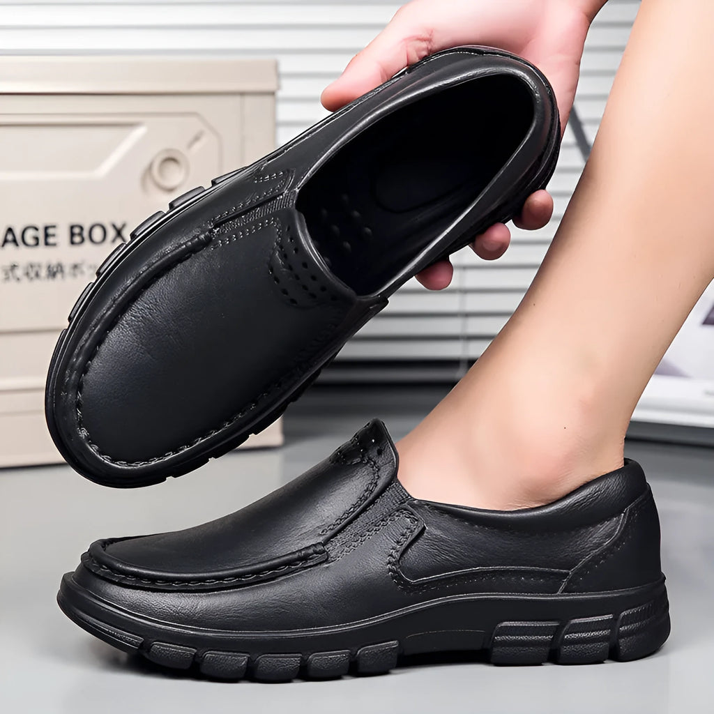 Men's black slip-on work shoes with artificial leather upper and platform mid-heel design