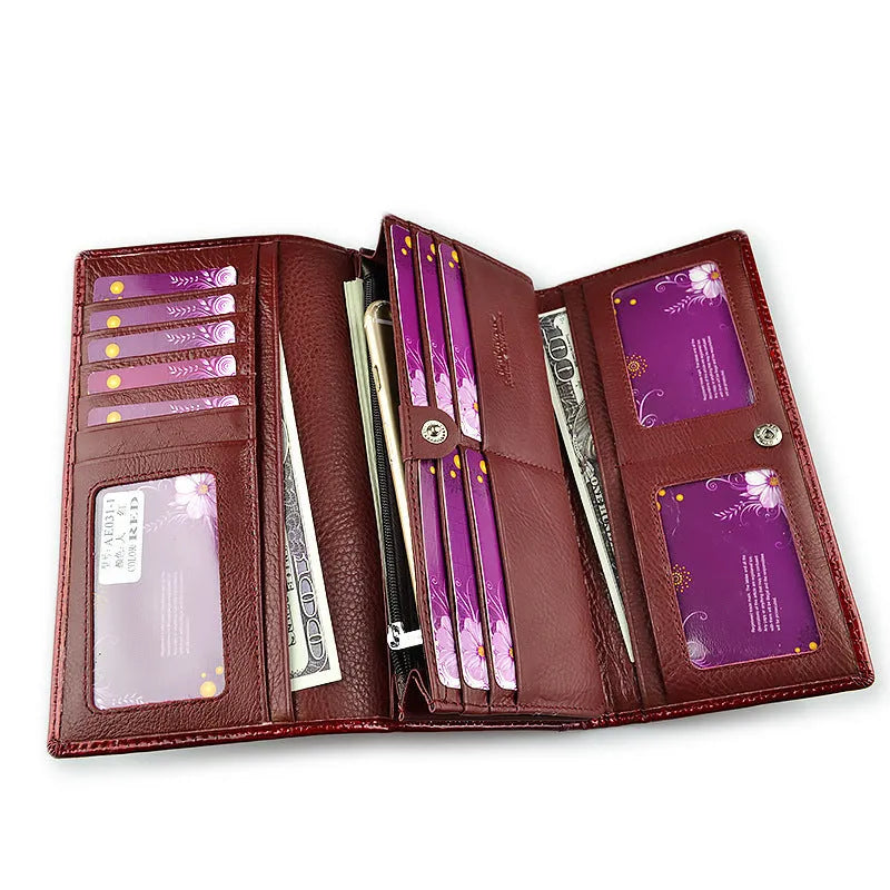 Women's leather purse with crocodile pattern design in wine red colour showing interior pigskin lining