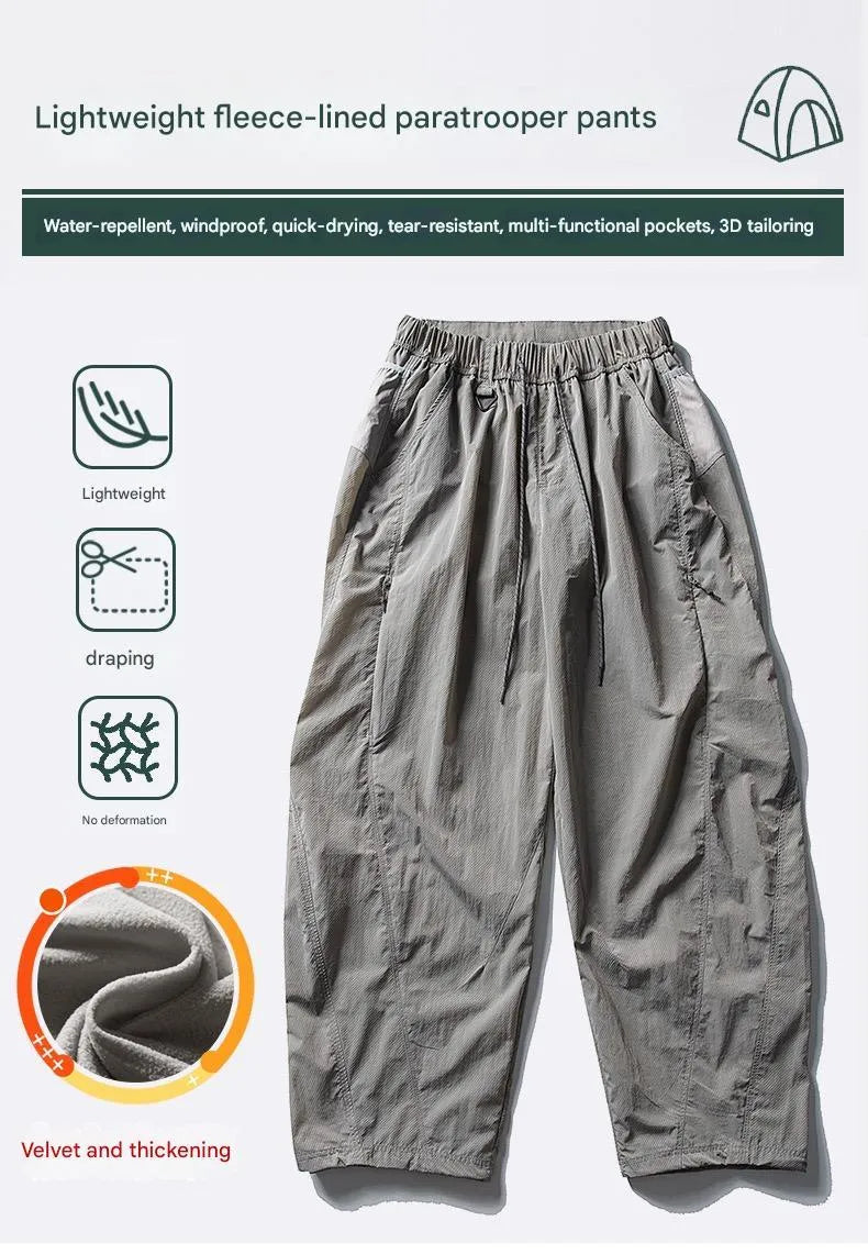 Fleece-lined quick-dry paratrooper cargo pants in army green with cargo pockets and adjustable ankle cuffs.