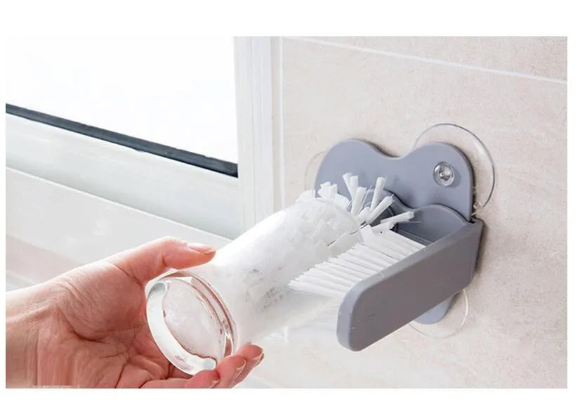 Grey rotating double-head cup cleaning brush with suction cups for wall mounting