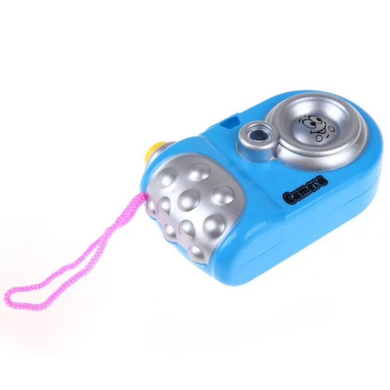 Blue or pink kids plastic projection camera toy with sliding lip, showing dinosaur and dolphin images.