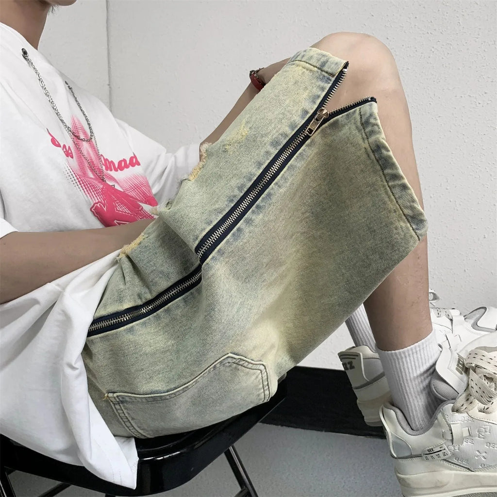 Retro blue men's ripped denim shorts with a loose fit and straight leg opening on a cardigan.