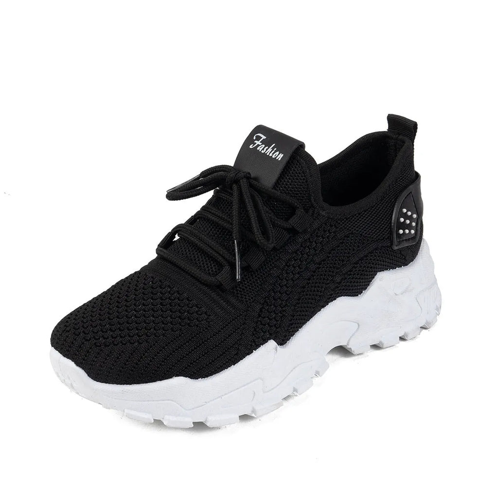 Women's white Flyknit mesh casual sports shoes with flat heel and lace-up front.