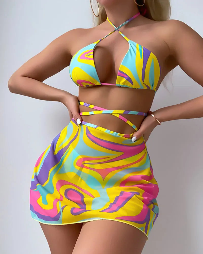 Yellow striped halter-neck swimsuit with lace-up front, matching skirt, and shorts