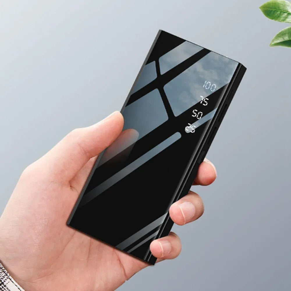 Black 20000mAh power bank with LCD display showing battery percentage, dual USB ports, and compact rectangular design