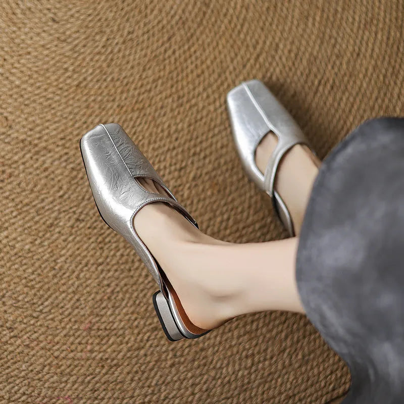 Square head outdoor slippers with low heel in black colour showing artificial PU upper and rubber sole