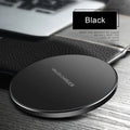 Ultra-thin black wireless charging pad measuring 98mm square with 6.5mm thickness on desk surface