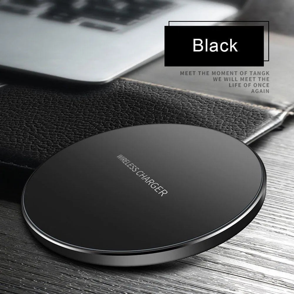 Ultra-thin black wireless charging pad measuring 98mm square with 6.5mm thickness on desk surface
