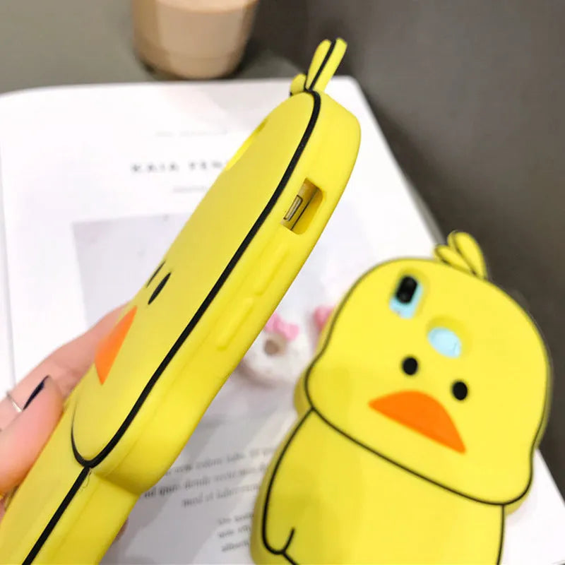 Green silicone iPhone case with cartoon animal design showing raised edges and precise port cutouts for charging and audio